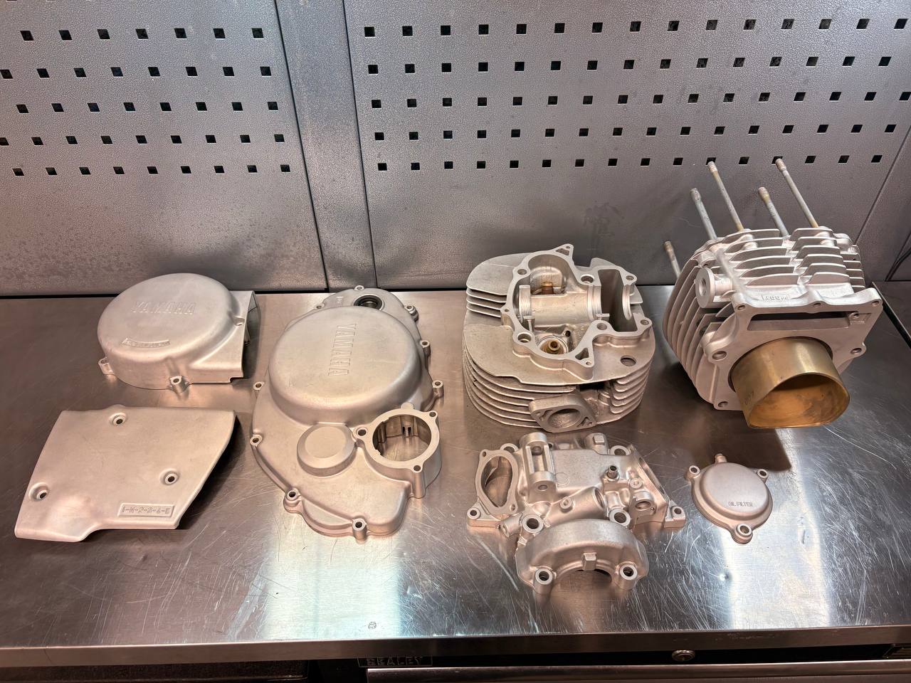 Yamaha motorcycle engine castings with a clean satin finish after VMC vapour blasting